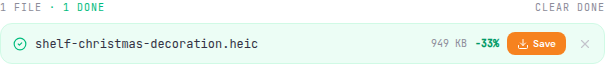 A finished HEIC file in the queue showing its new KB size, a green percentage-smaller badge, and a Save button